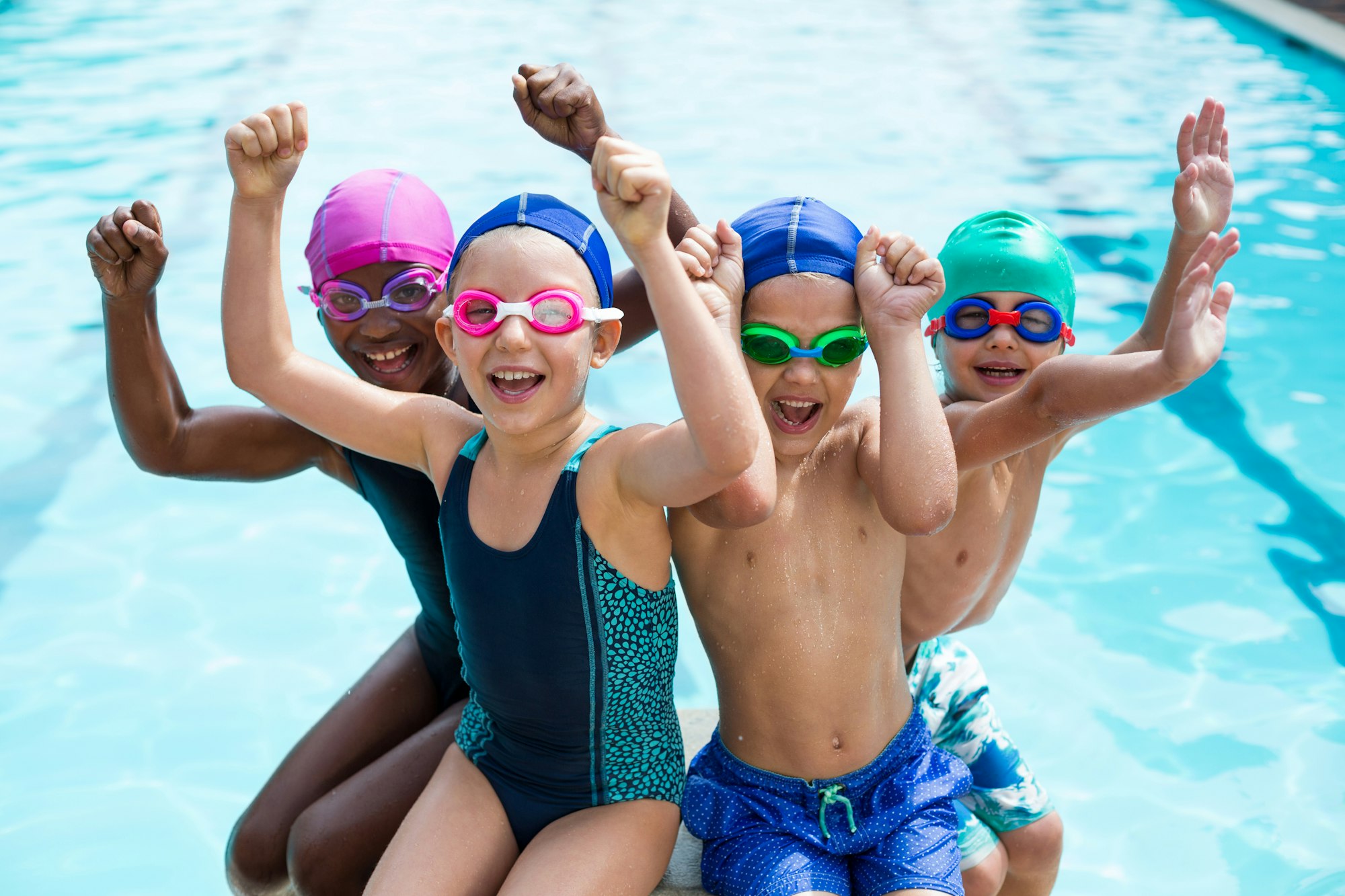 Cheerful children enjoying at poolside