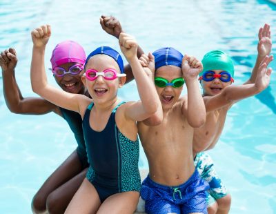 Cheerful children enjoying at poolside